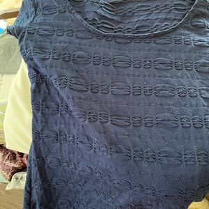 Short sleeve form fitting navy cotton textured dress.